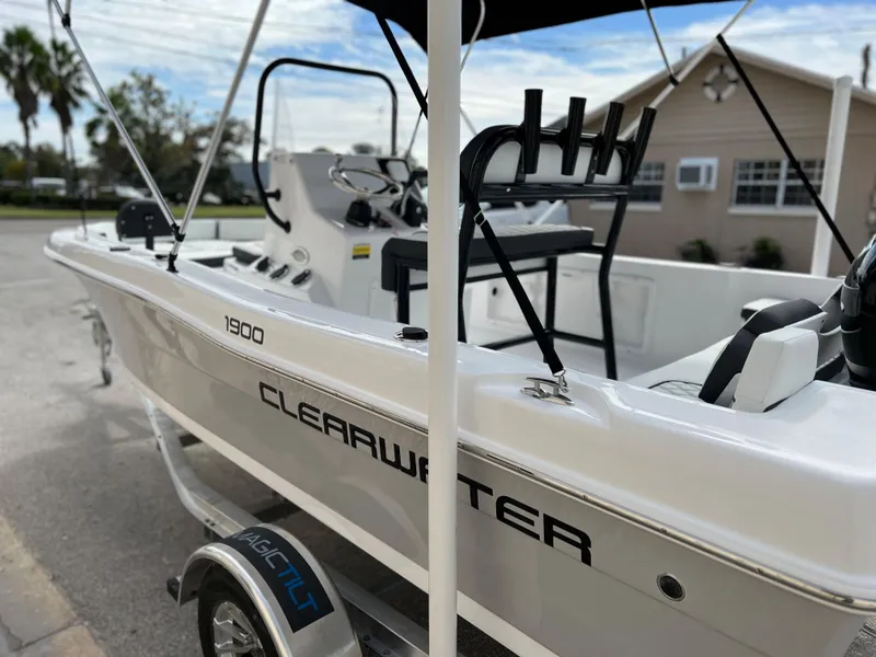 Slide: The Image of 2024 Clearwater 1900 boat on trailer, side view, outdoor setting. - 23