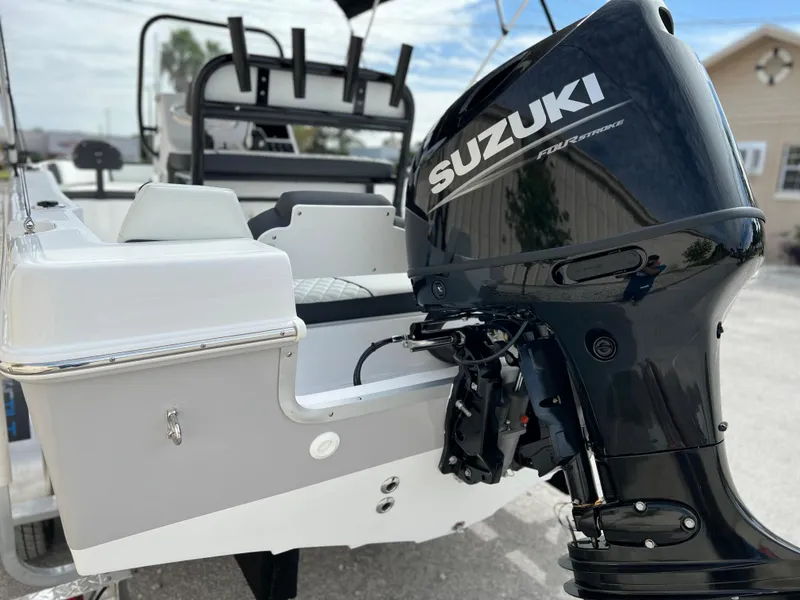 Slide: The Image of 2024 Clearwater 1900 boat with Suzuki outboard motor, rear view. - 24