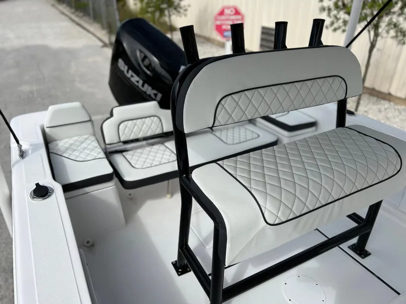 Slide: The Image of 2024 Clearwater 1900 boat interior with Suzuki engine and diamond-stitched seating. - 29