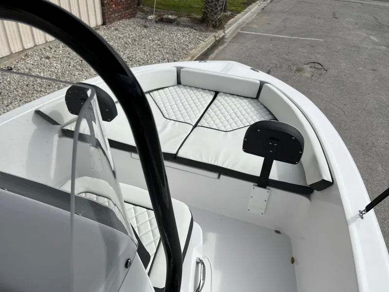 Slide: The Image of 2024 Clearwater 1900 boat interior with white cushioned seating. - 33