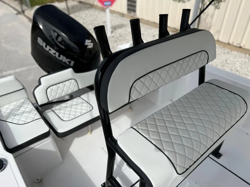 Slide: The Image of 2024 Clearwater 1900 boat interior with Suzuki engine and diamond-stitched seating. - 34