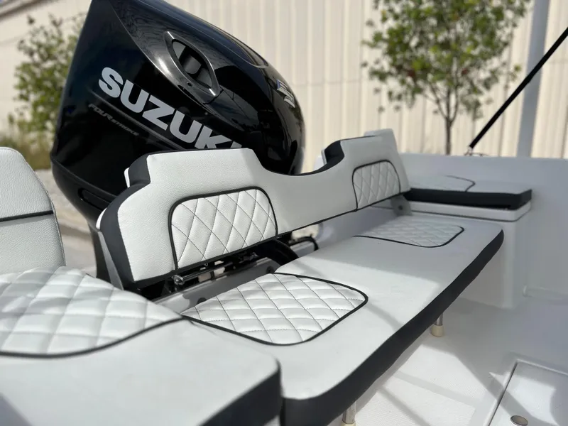 Slide: The Image of Clearwater 1900 boat 2024 model with Suzuki outboard motor and cushioned seating. - 9