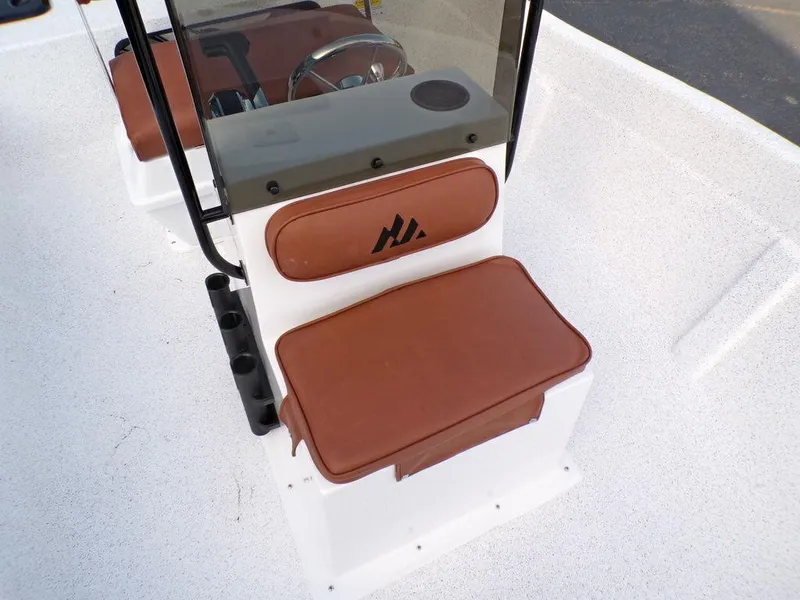 Slide: The Image of 2024 Skiff 160 PRO-Vee livewell with open lid, showcasing interior design. - 10