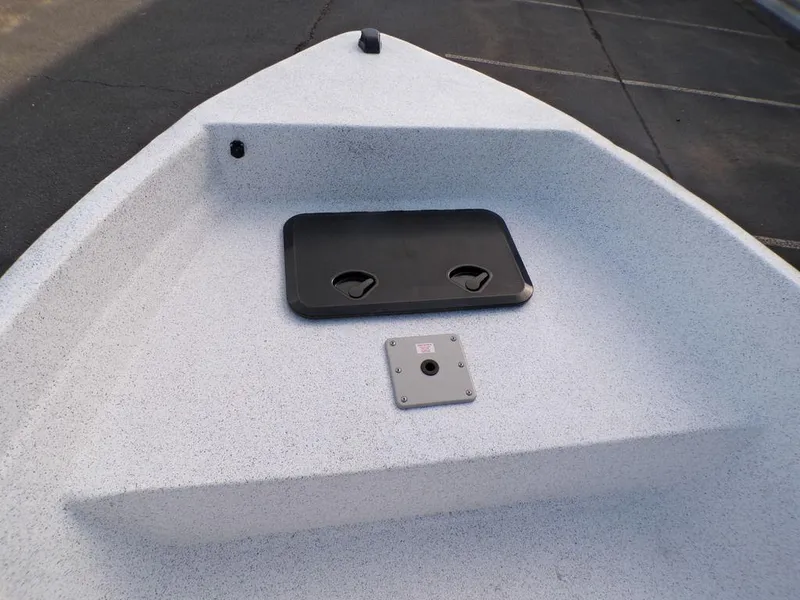 Slide: The Image of 2024 Skiff 160 PRO-Vee boat console with steering wheel and navigation controls. - 13