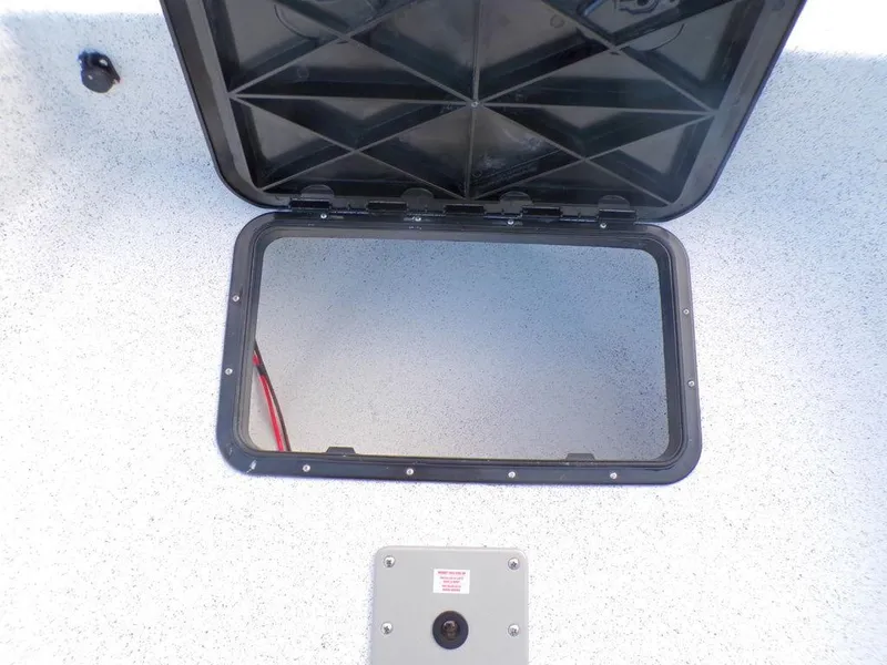 Slide: The Image of Open storage compartment on 2024 Skiff 160 PRO-Vee boat, featuring a durable design. - 14