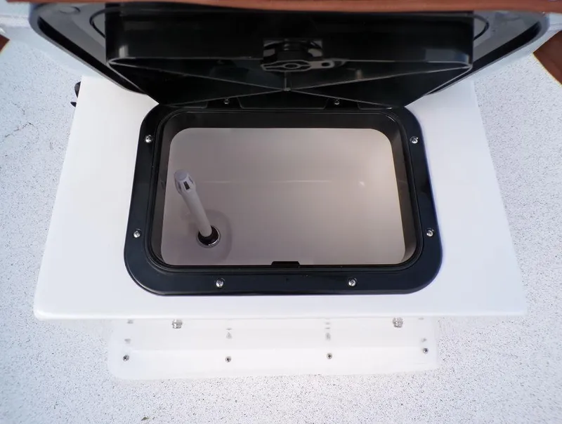 Slide: The Image of 2024 Skiff 160 PRO-Vee boat interior with steering console and brown seat. - 20