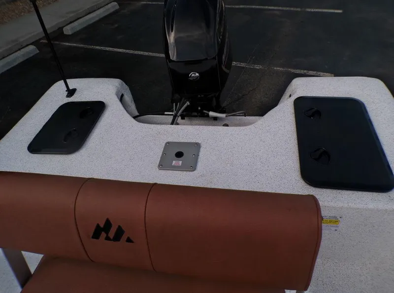 Slide: The Image of 2024 Skiff 160 PRO-Vee boat interior with storage compartment and wiring details. - 6