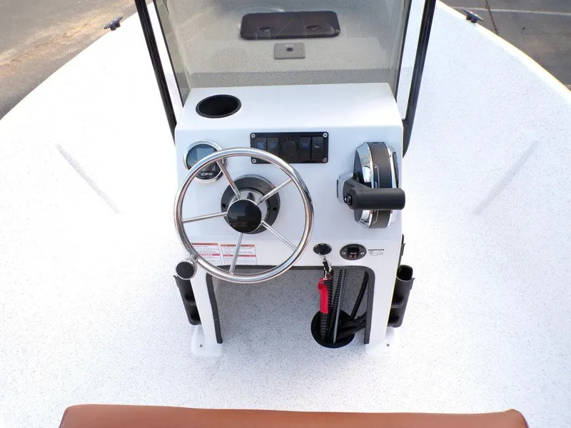 Slide: The Image of 2024 Skiff 160 PRO-Vee boat seat with brown cushion and white base. - 9