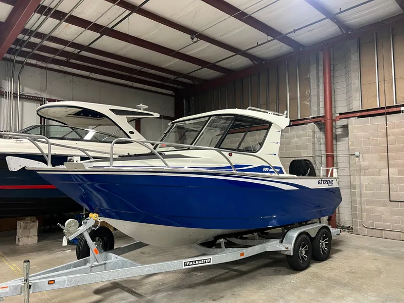 Slide: The Image of Extreme Boats 695 Game King 23' Ocean Blue Hull with White Top - 1