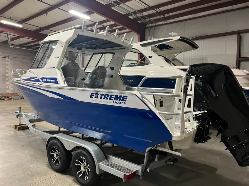 Slide: The Image of Ocean Blue Hull w/White Top with Trailer - 36