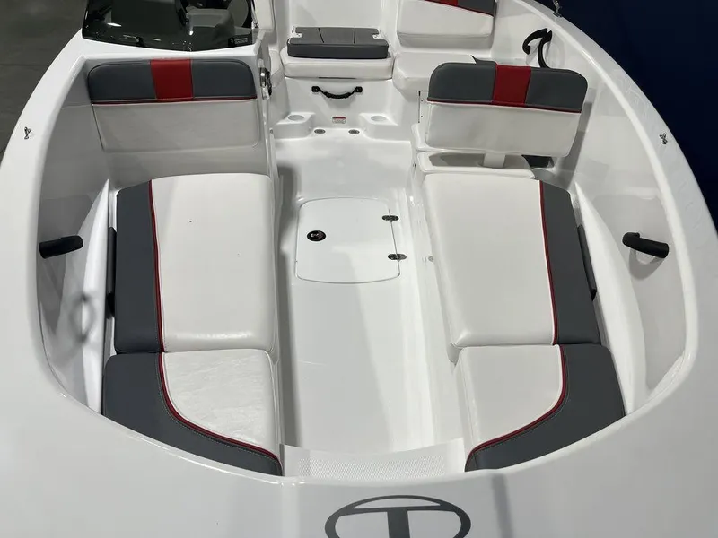 Slide: The Image of 2024 Tahoe T16 boat interior with white and gray seating, red accents, and ample storage. - 10