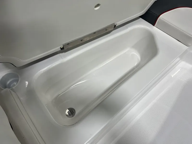 Slide: The Image of 2024 Tahoe T16 boat storage compartment with drain plug. - 12