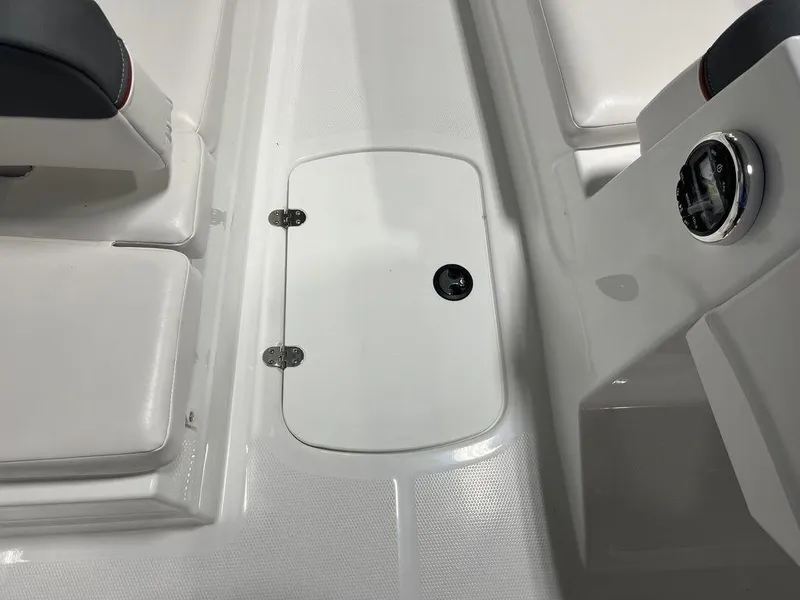 Slide: The Image of 2024 Tahoe T16 boat interior with storage compartment and seating. - 17