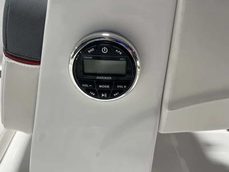 Slide: The Image of 2024 Tahoe T16 boat audio control panel with Kicker stereo system. - 28
