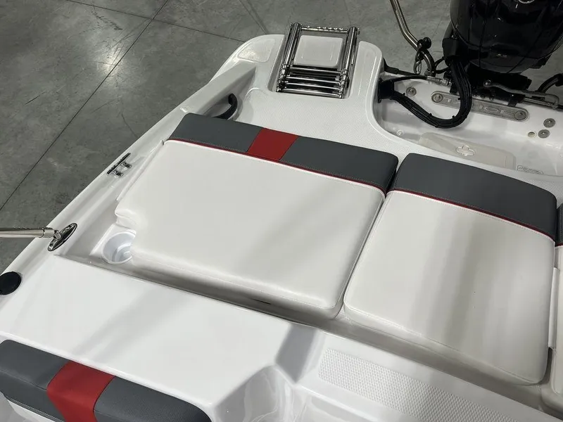 Slide: The Image of 2024 Tahoe T16 boat interior with white and gray seating. - 30