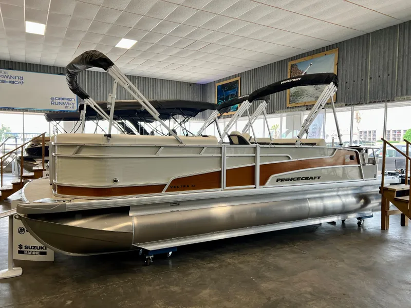 The Image of 2024 Princecraft Vectra 23 RL pontoon boat displayed indoors. - 0
