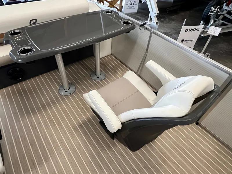 Slide: The Image of 2024 Princecraft Vectra 23 RL boat interior with table and captain's chair. - 12