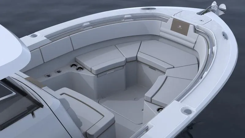 Slide: The Image of 2023 Bertram 28 CC boat interior with cushioned seating and modern design. - 16