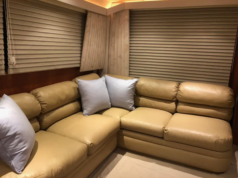 Slide: The Image of Luxurious beige leather seating in 1990 Viking 38 Convertible yacht interior. - 14