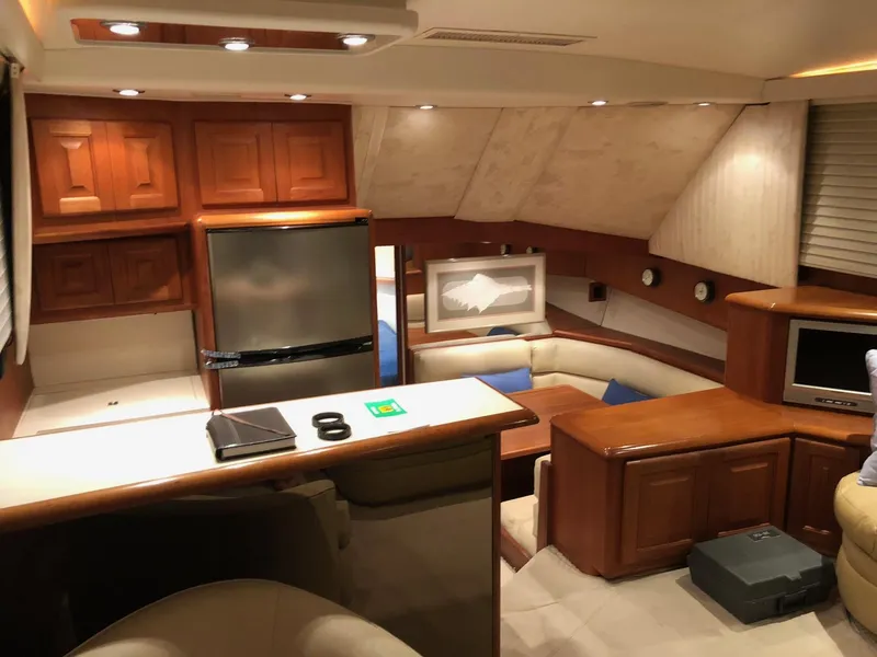 Slide: The Image of Interior of a 1990 Viking 38 Convertible yacht with wood cabinetry and modern amenities. - 15