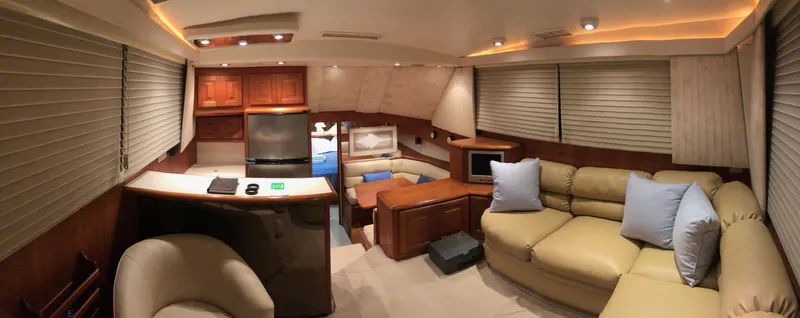 Slide: The Image of Luxurious interior of a 1990 Viking 38 Convertible yacht with modern furnishings. - 17