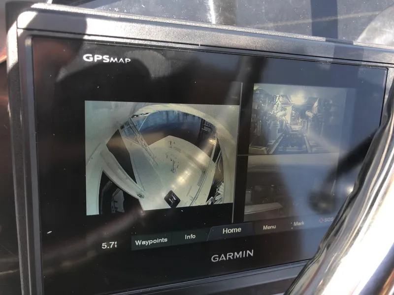 Slide: The Image of Garmin GPS display on 1990 Viking 38 Convertible boat, showing navigation and camera views. - 22