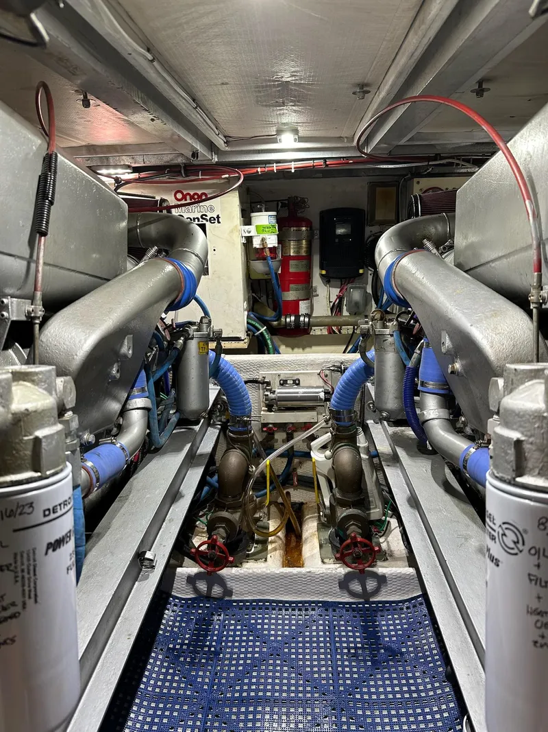 Slide: The Image of Engine room of 1990 Viking 38 Convertible boat with visible machinery and components. - 27