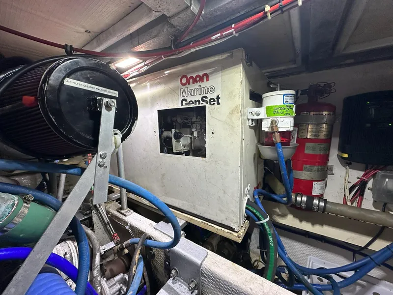 Slide: The Image of Engine room of 1990 Viking 38 Convertible with Onan Marine GenSet. - 28