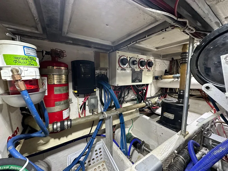 Slide: The Image of Engine room of 1990 Viking 38 Convertible boat with gauges and fire extinguisher. - 29