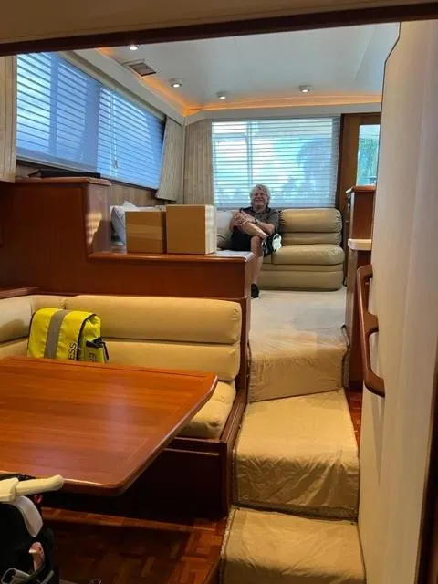 Slide: The Image of Interior of a 1990 Viking 38 Convertible yacht with seating and dining area. - 7