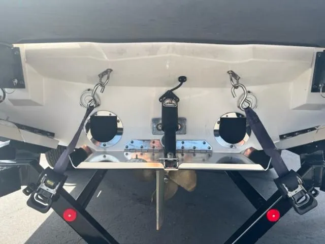 Slide: The Image of 2019 MasterCraft XT25 boat stern with propeller and trailer straps. - 8