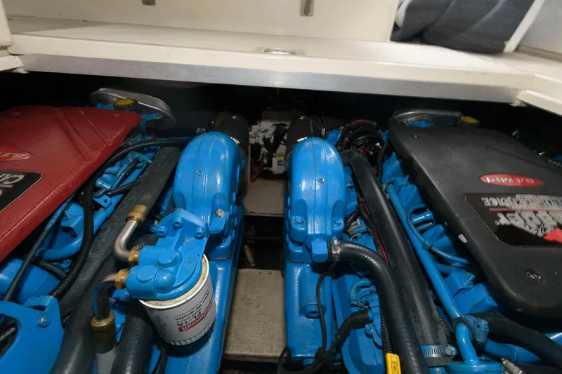 Slide: The Image of Engine compartment of a 2002 Cruisers Yachts 3372 Express with twin blue engines. - 25