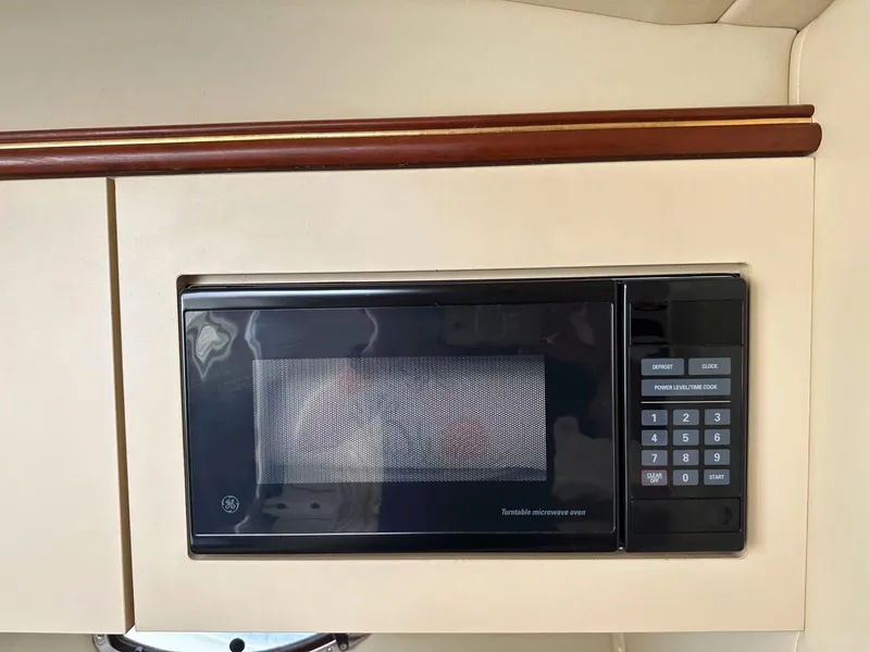 Slide: The Image of Built-in microwave in 2002 Cruisers Yachts 3372 Express galley. - 24