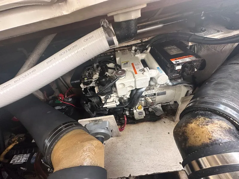 Slide: The Image of Engine compartment of a 2002 Cruisers Yachts 3372 Express boat. - 28