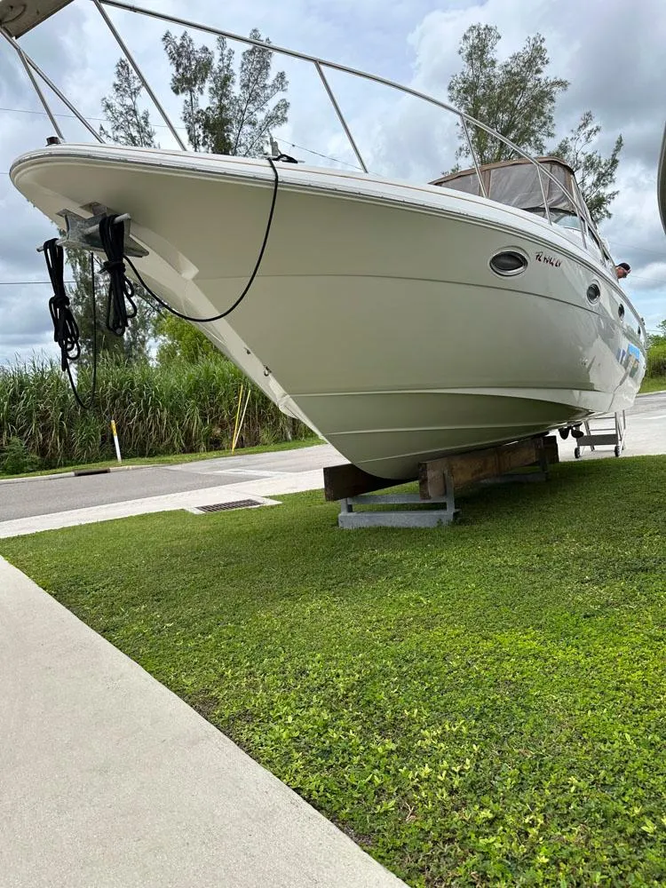Slide: The Image of 2002 Cruisers Yachts 3372 Express on dry dock, side view. - 6