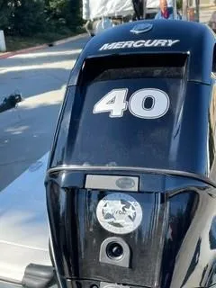 Slide: The Image of 2024 Mako Pro Skiff 13 CC with Mercury 40 HP outboard motor. - 3