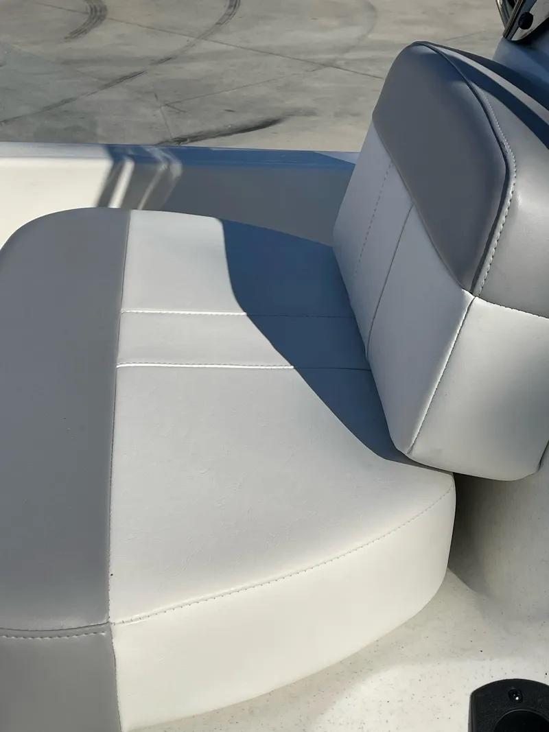 Slide: The Image of 2024 Mako Pro Skiff 13 CC boat seat, gray and white upholstery. - 6