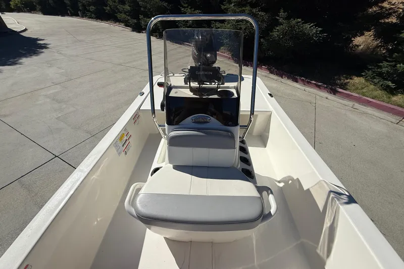 Slide: The Image of 2024 Mako Pro Skiff 13 CC boat interior with console and seating. - 10
