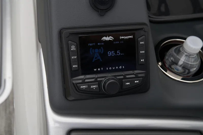 Slide: The Image of 2024 Ranger Reata 243C boat stereo system with cup holder and water bottle. - 39