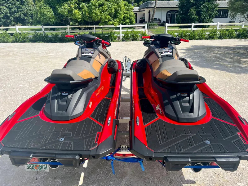 Slide: The Image of 2022 Yamaha WaveRunner VX Cruisers Limited, red, parked on a trailer in a driveway. - 11