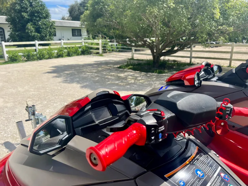 Slide: The Image of 2022 Yamaha WaveRunner VX Cruisers Limited with red handlebars in a sunny outdoor setting. - 12