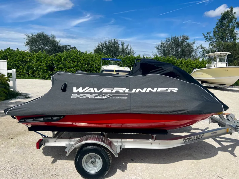 Slide: The Image of 2022 Yamaha WaveRunner VX Cruisers Limited on trailer with cover, parked outdoors. - 17