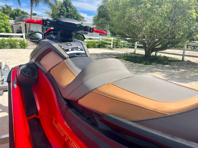 Slide: The Image of 2022 Yamaha WaveRunner VX Cruisers Limited in red, parked outdoors. - 8