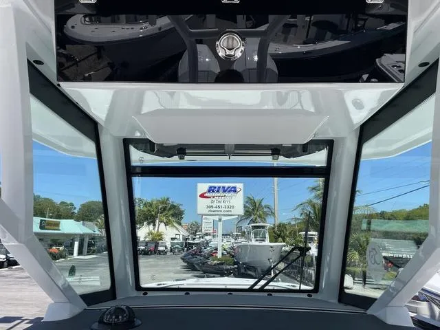 Slide: The Image of 2023 Blackfin 272CC boat windshield view at a dealership. - 13