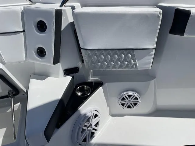 Slide: The Image of 2023 Blackfin 272CC boat interior with speakers and cup holder. - 15