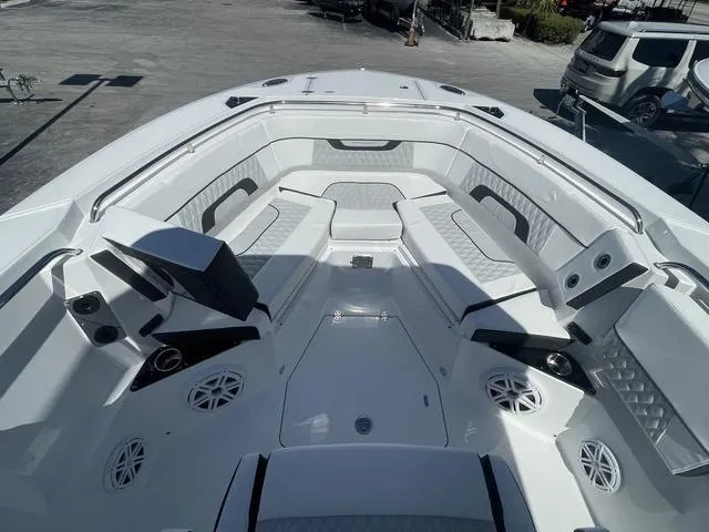 Slide: The Image of 2023 Blackfin 272CC boat interior with seating and speakers. - 17