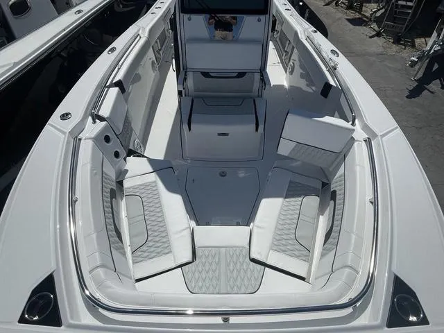 Slide: The Image of 2023 Blackfin 272CC boat interior with spacious seating and modern design. - 18