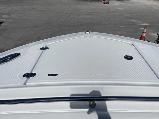 Slide: The Image of 2023 Blackfin 272CC boat bow deck in a parking lot. - 22
