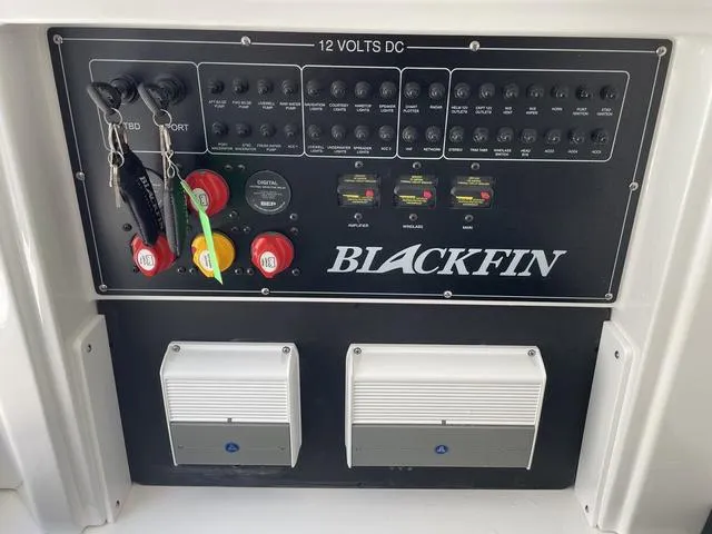 Slide: The Image of 2023 Blackfin 272CC control panel with switches and key ignition. - 26