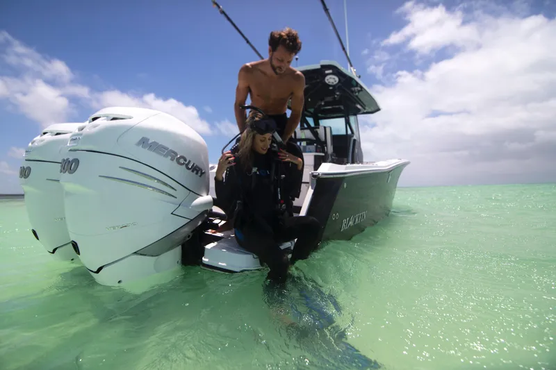 Slide: The Image of 2023 Blackfin 272CC boat with Mercury engines in shallow water. - 45